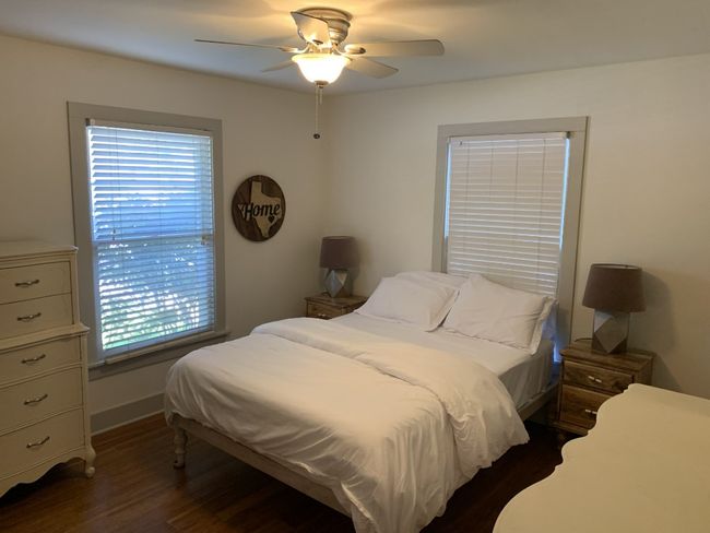 Primary bedroom with a ceiling fan | Image 10