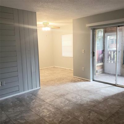 entering front door, living room, patio and dining room | Image 2