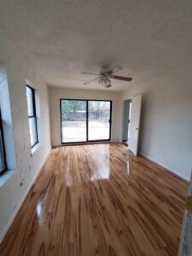 Unfurnished living room featuring wood finished floors and a ceiling fan | Image 20