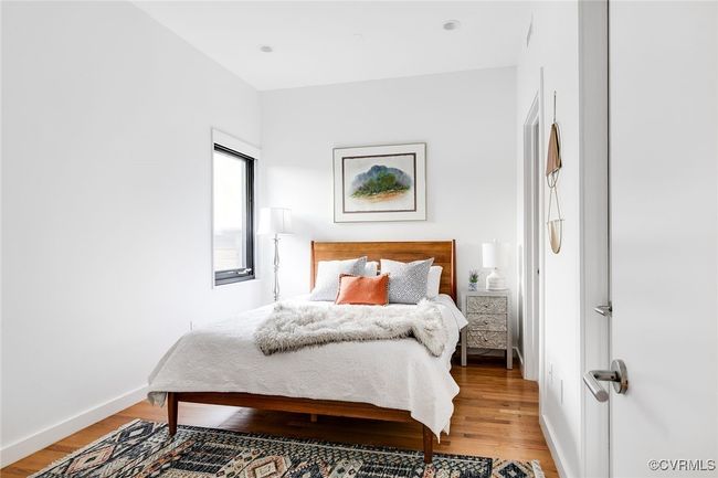 First floor bedroom with en suite bath and walk in closet. | Image 25