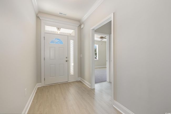 Entrance foyer with light wood-type flooring and ornamental molding | Image 5