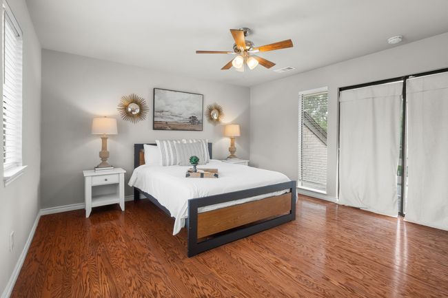 Bedroom featuring, access to balcony, and a ceiling fan | Image 31