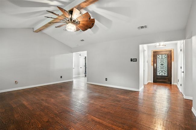 Entrance foyer featuring ceiling fan and wood finished floors | Image 8