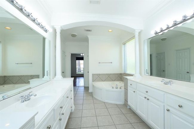 Extended vanities to provide room on both sides of the sink. Cabinets with hardware. | Image 21