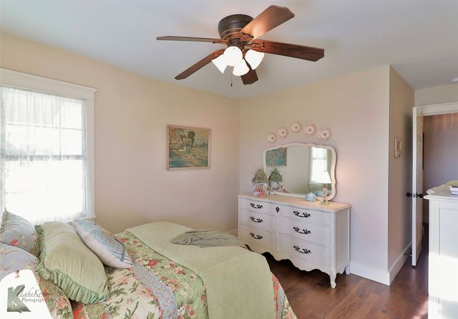 Bedroom featuring wood floors and a ceiling fan | Image 19