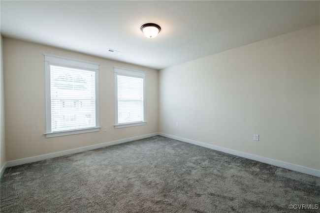 Carpeted empty room featuring baseboards | Image 29