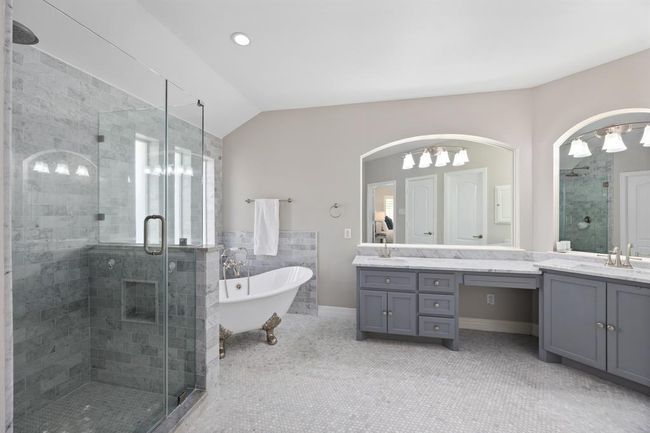 Completely remodeled from head-to-toe, the marble-drenched primary bathroom is the ultimate retreat. | Image 26