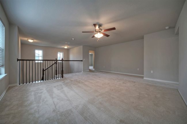 Empty room featuring baseboards, carpet floors, and a ceiling fan | Image 16