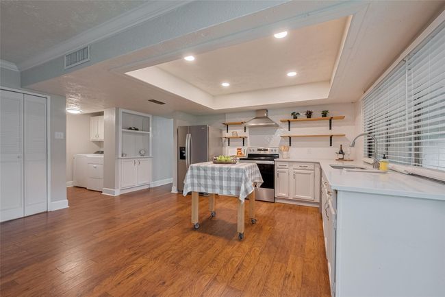 View of utility room located off the kitchen | Image 12