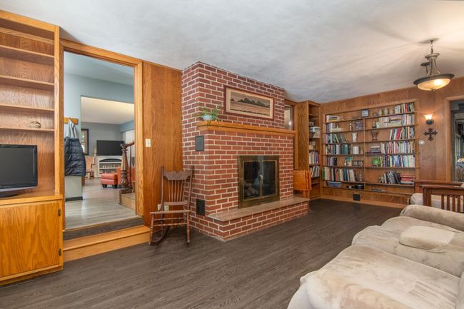 Cozy up by the fireplace in the family room | Image 14