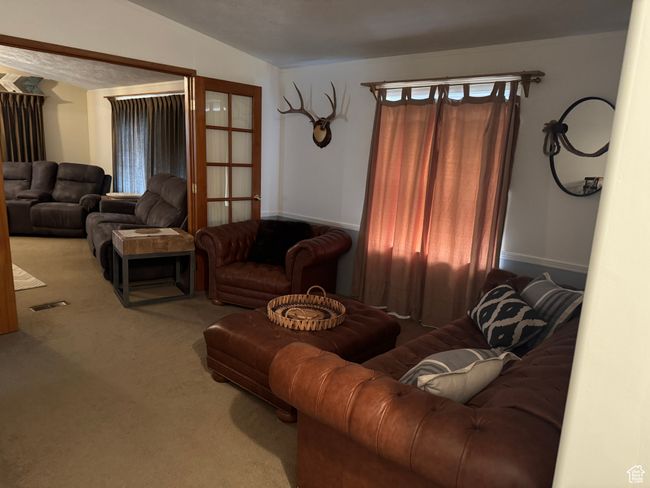 View of carpeted living area | Image 10