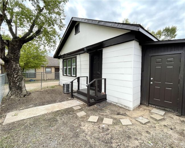 View of front of home featuring fence and central air condition unit | Image 13