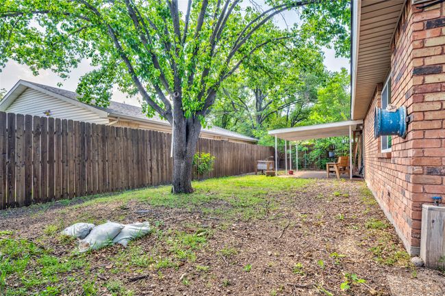 View of fenced backyard | Image 38