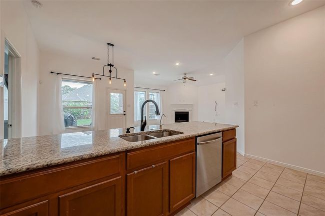 Kitchen is open to dining and living room | Image 11