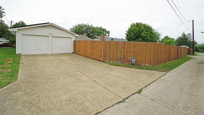 The garage is accessed from the alley behind. See this great home and make it yours today! | Image 25