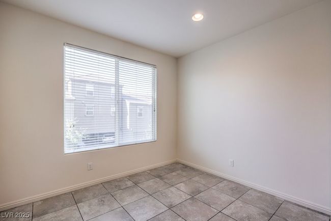 Unfurnished room with light tile patterned floors and baseboards | Image 19