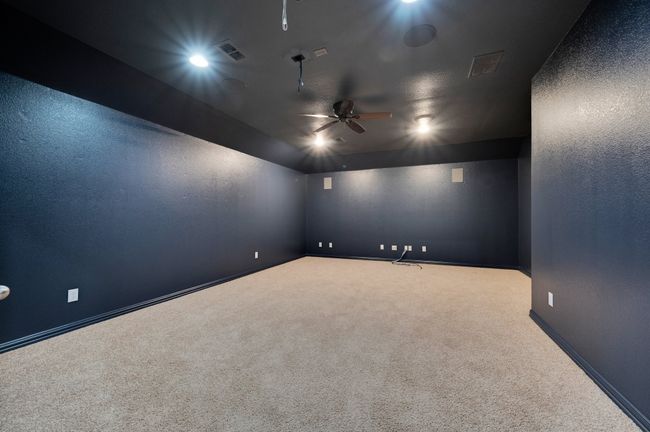 Media room wired for equipment and can accommodate larger furnishings. | Image 22