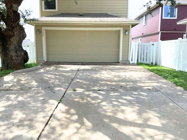 Garage with concrete driveway | Image 29