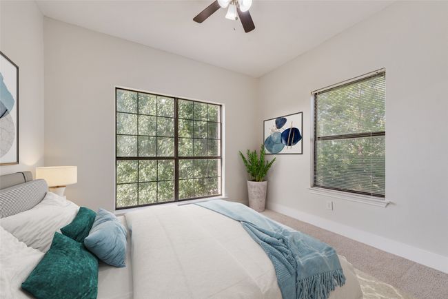 Bedroom with carpet flooring and ceiling fan | Image 15