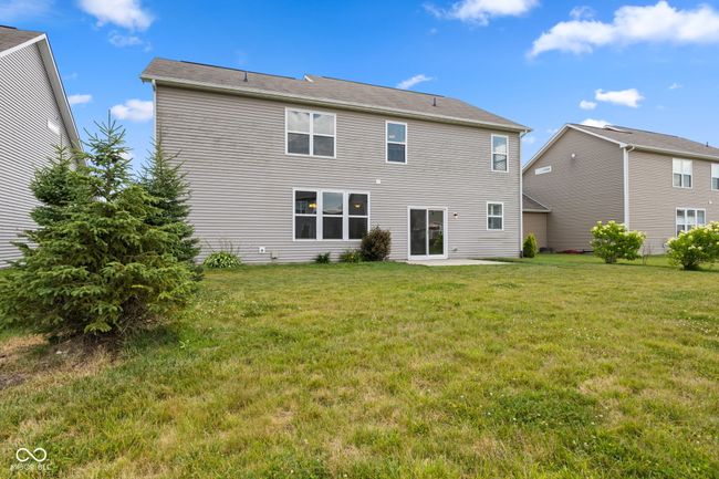 Rear view of property with a lawn, patio and professionally landscaped lawn | Image 28