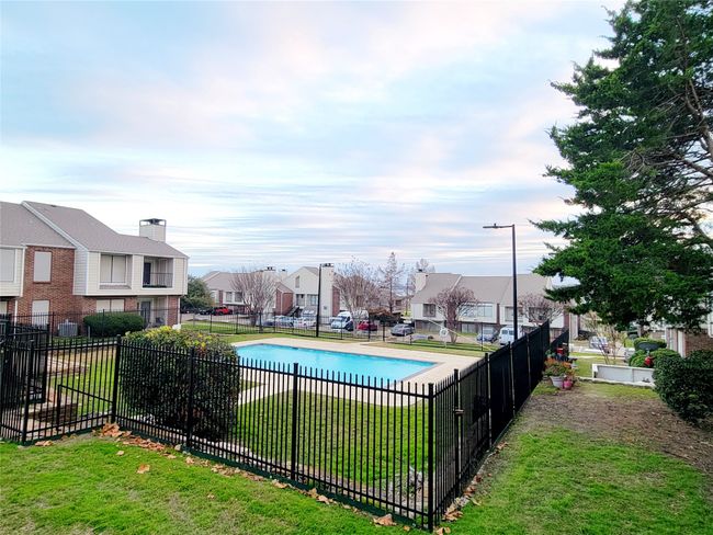 View of pool with a lawn | Image 23