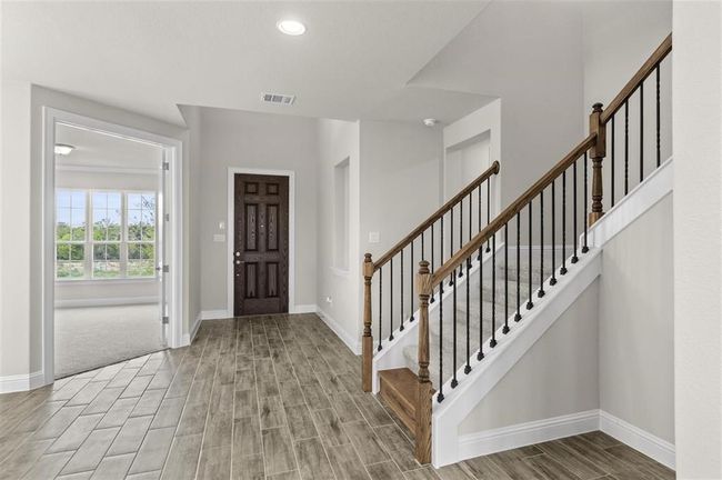 Foyer featuring baseboards, wood finished floors, and recessed lighting | Image 4