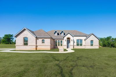 French provincial home with a front yard | Image 1