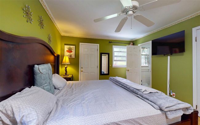 Bedroom with crown molding and a ceiling fan | Image 27