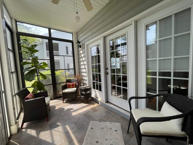 This 3 Season Sunroom (Rear Porch) has an Xtra Large Closet offering Plenty of Storage with shelving. | Image 26