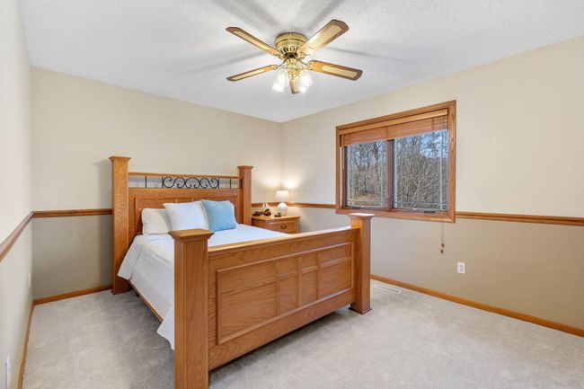 Bedroom one has tons of light pouring in from the east facing windows. | Image 14