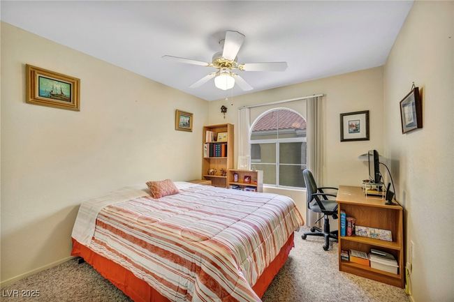Bedroom with carpet floors, a ceiling fan, and baseboards | Image 15