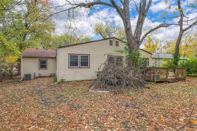 Rear view of house with cooling unit and a deck | Image 3