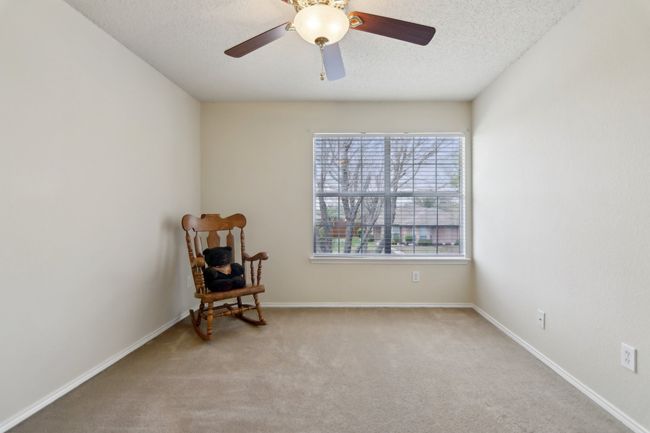 Living area with carpet flooring, baseboards, ceiling fan, and a textured ceiling | Image 27