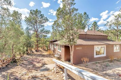 The dream is real... Welcome to your vintage log cabin within an hour of Denver, with high speed internet and all the ourdoor activities you can imagine right out the back door... | Image 1