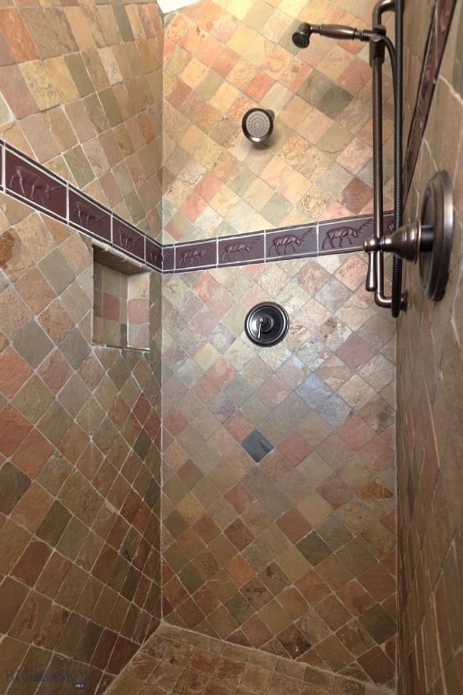 Entry level Bathroom 2 custom tiled shower. | Image 60