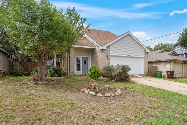 View of front of house featuring brick siding, a garage, concrete driveway, and a shingled roof | Image 29
