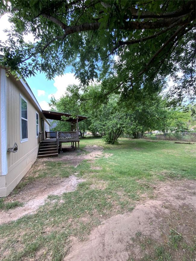 View of yard featuring a deck | Image 33
