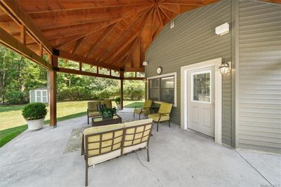 View of patio / terrace with a storage shed, a gazebo, and an outdoor hangout area | Image 3