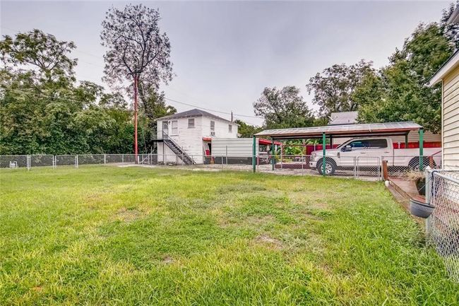 View of yard featuring a detached carport | Image 24