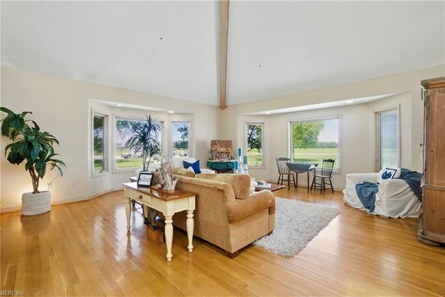 Wood beams featured in the downstairs living spaces. | Image 5