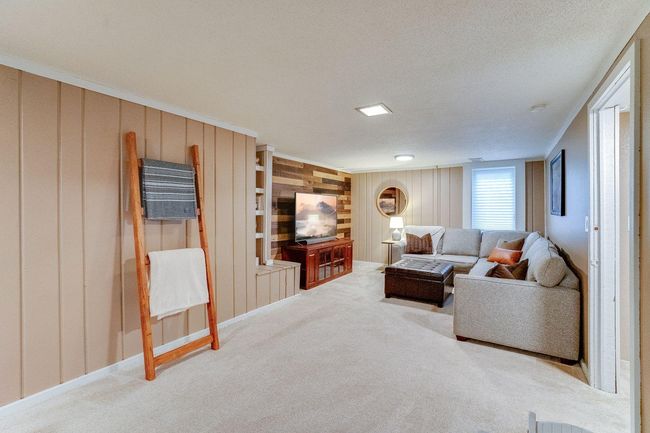 Wood feature wall and egress window | Image 21