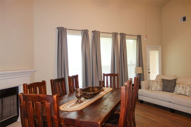 Living are being used as a formal dining and family room | Image 10
