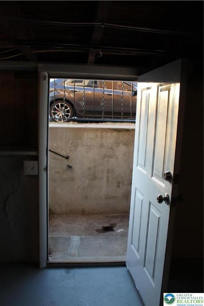 Door in the lower level leading to the steps outside | Image 20