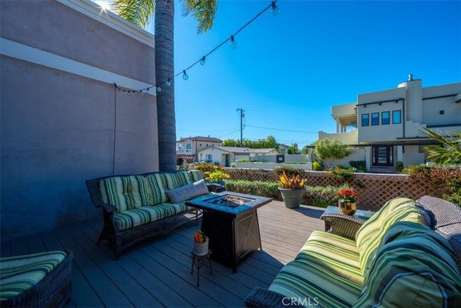 Another view of the deck off the entry. Sit around the fire pit on a cool evening. | Image 54