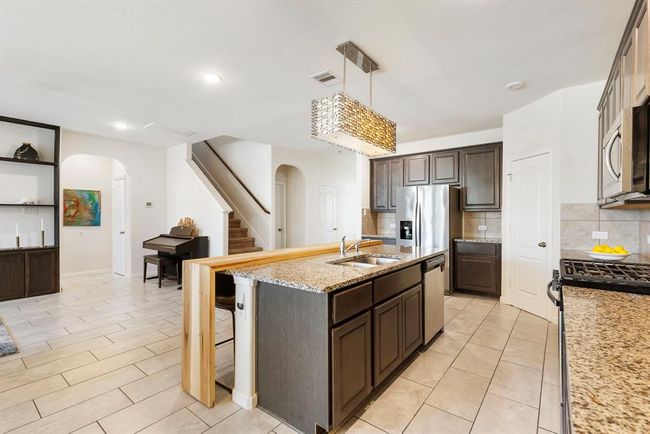 Another view of the kitchen from the dining area. | Image 13