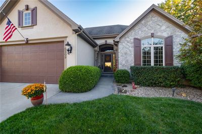 View of front of home featuring a garage and a front lawn | Image 3