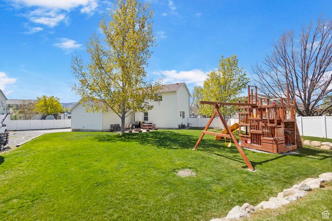 View of yard with a fenced backyard and a playground | Image 36