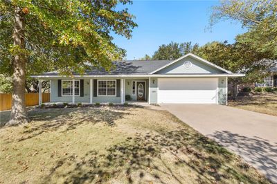 Front of home with view of the covered front porch. | Image 1