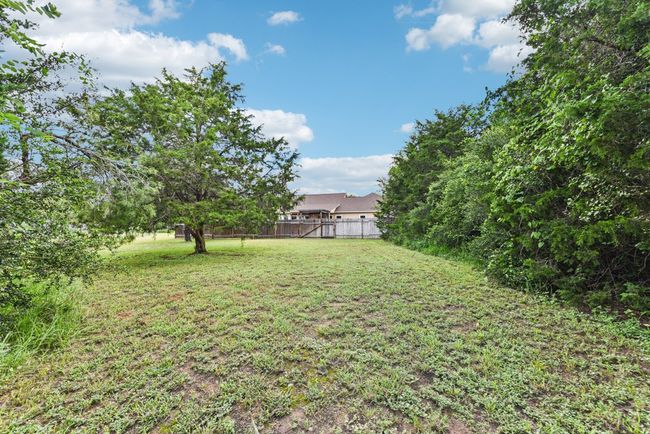 Yard behind fenced area | Image 36