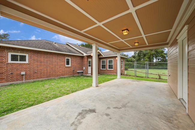 RELAX ON THE COVERED BACK PORCH TO THIS LARGE AIR CONDITIONED WORKSHOP THAT CAN BE USED FOR STORAGE, MAN CAVE, SHE SHED, HOBBY ROOM, GAME ROOM, TOOL SHOP COMPLETE WITH CUSTOM CABINETS | Image 49